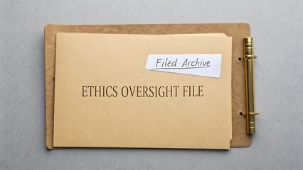 Ethics Oversight File on a Brown Folder with a Note for Filed Archive in an Organized Office Setting
