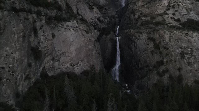 4K cinematic drone footage of Upper and Lower Yosemite Falls in Yosemite National Park during rare muted, overcast light.