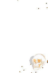 Gold skull with confetti design element