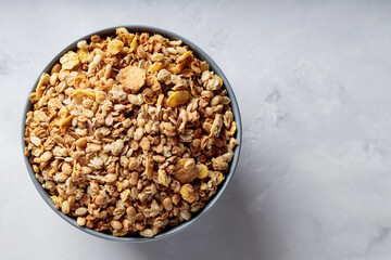 Bowl of Dry Granola Cereal on Gray Background Nutritious Snack Copy Space