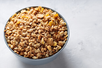 Bowl of Dry Granola Cereal on Gray Background Nutritious Snack Copy Space
