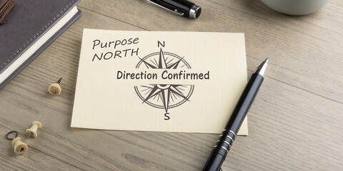 Purposeful journey to achieve goals with compass illustration and confirmation message on note paper with writing tools and notebook