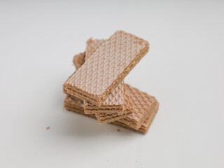 Stack of wafer biscuits on white background
