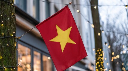 Vibrant red flag of Vietnam hanging against a festive backdrop in a cozy street
