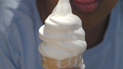 Enjoying delicious soft serve ice cream on a sunny day