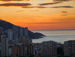 Fototapeta premium dramatic coastal skyline illumination, photographer captures warm golden hue over tranquil water