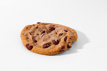Thick chocolate chip cookie on a white background. 