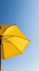 Golden summer parasol against cerulean canvas offering radiant sun protection bliss