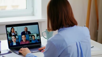 Businesswoman in virtual meeting, remote collaboration with colleagues on laptop - Powered by Adobe