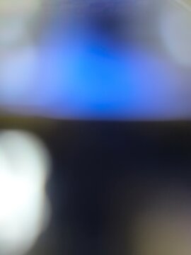 blurry blue and dark abstract background with light