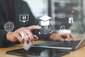 Close-up of a businessman using a digital interface with an AI education icon, symbolizing e-learning, future skills, and modern AI training.