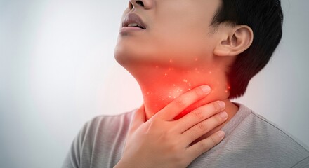 Young man suffering from painful throat inflammation or sore neck medical problem concept