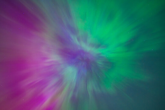 Abstract Aurora Borealis Corona Overhead: Vivid Pink Purple and Green Northern Lights Explosion Looking Straight Up at Zenith