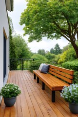 Obraz premium Wooden deck patio with bench overlooking green garden