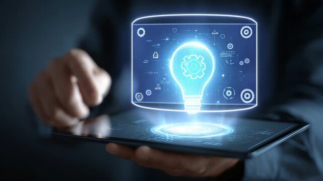 A close-up view of a hand interacting with a digital tablet displaying a glowing light bulb icon, symbolizing innovation, creativity, and modern technology.