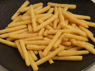 Potato stick crunchy snacks isolated on white background 