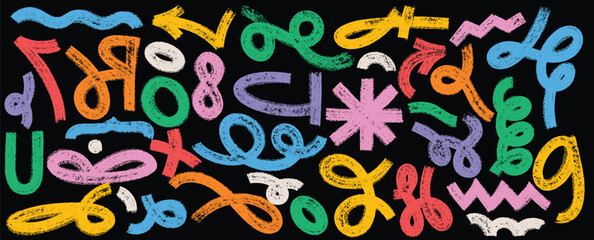 A black background is covered with colorful crudely drawn crayon marks in a variety of shapes lines and directions