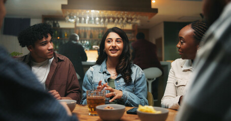 Conversation, friends and people in pub, alcohol and bonding together with reunion. Group, men and women in restaurant, discussion and laughing with joke, beverage and social gathering with happiness