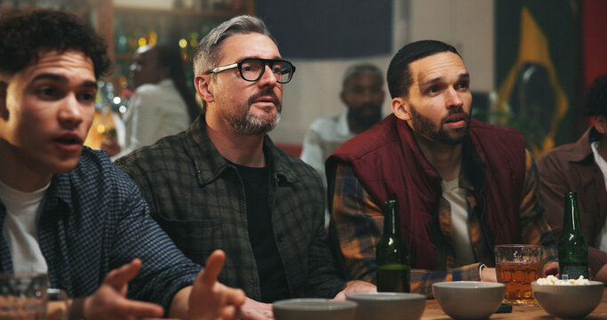 Anxiety, watching tv and men in pub for sports game with championship for entertainment together. Stress, live streaming and group of male friends with football match in bar for online tournament.