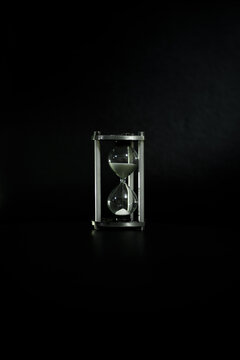 hourglass on black background