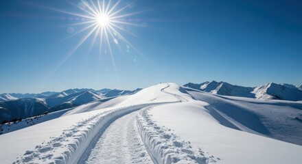 Sunny mountain snow path with tracks and sunburst sky