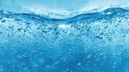 Clear blue water filled with bubbles creates a serene atmosphere. Light reflects beautifully off the surface enhancing the calming effect of the underwater scene.