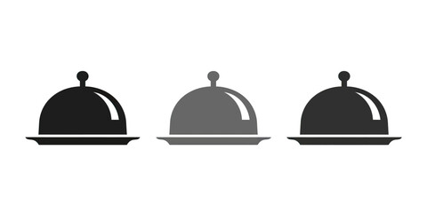 Obraz premium Three minimalist service cloches on plates in black, gray, and dark gray shades
