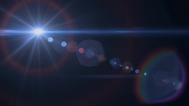 Bright light with lens flares on a dark background