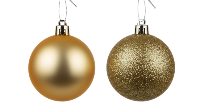 Elegant golden Christmas baubles against a dark black background closeup