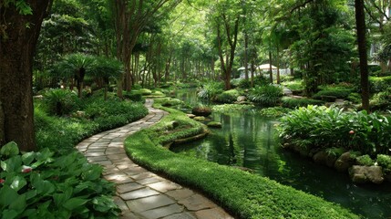 Fototapeta premium A winding stone pathway leads through a vibrant garden filled with lush plants and trees. Calm waters reflect the greenery creating a peaceful oasis for relaxation and nature enjoyment.