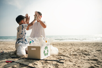 family, conservation, environmental, clean, beach, holiday, A father and son celebrate after collecting plastic waste during a beach cleanup, promoting responsibility and environmental care.
