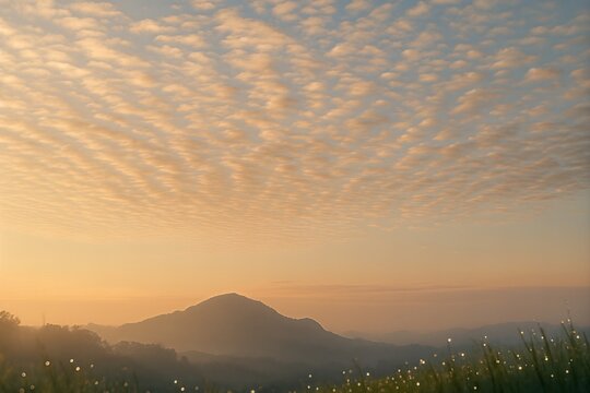 Soft cloud pattern over calm sea horizon