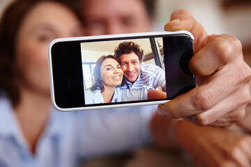 Happy couple, hand and selfie with phone screen for photography or social media picture in home. Man, woman or smile with mobile smartphone display for app, capture moment or memory together in house