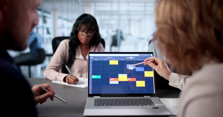 Team Of Diverse Professionals Scheduling Corporate Meeting