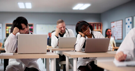 Medical Students In Classroom Looking Sad And Bored During Lecture