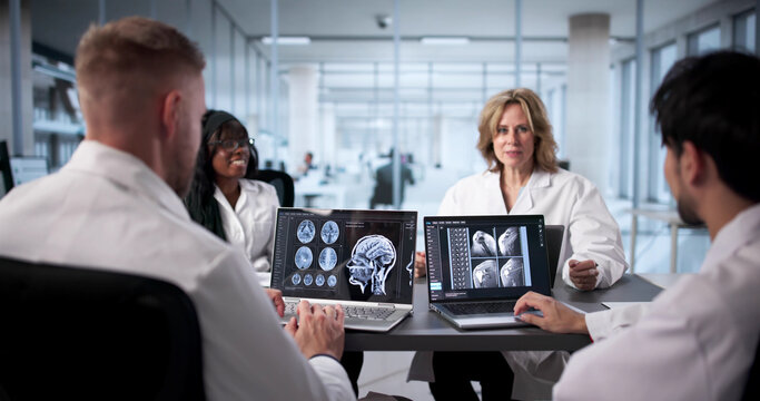 Neurologist At Hospital Analyzing Brain Scan - Powered by Adobe