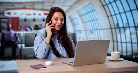 Traveling Businesswoman Multitasking With Mobile Phone And Laptop