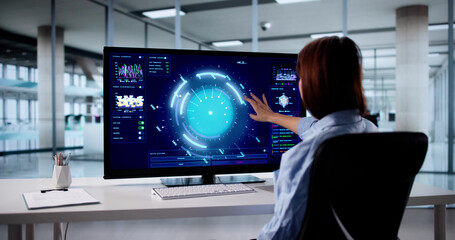 Fototapeta premium Financial Analyst Predicts Future Growth Using Computer Dashboard