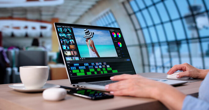 Female Graphic Designer Editing Video Montage On Laptop - Powered by Adobe