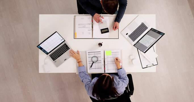 Top Man And Young Woman Doing Accounting Work