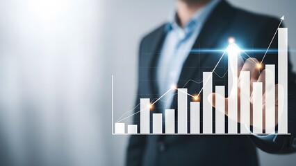 Businessman analyzing financial growth chart with digital interface and upward trend