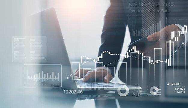 Business, finance and investment concept. Businessman using digital tablet analyzing financial data with economic graph growth chart, Business strategy and planning. market research