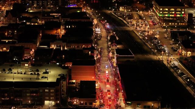  Aerial View of Front Street, Downtown Wheaton During 2025 Christmas Parade with Holiday Crowds and Lights&rdquo;