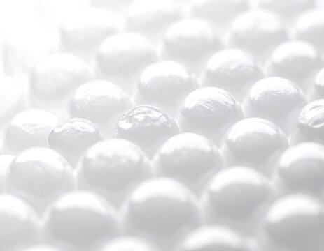 Close-up of spherical, reflective objects arranged in a repeating pattern