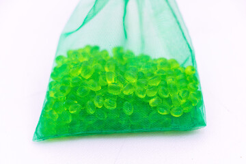 Green aroma beads in mesh bag - fresh scented decor concept