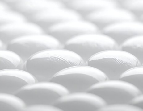 Close-up of translucent, spherical objects, arranged in a grid