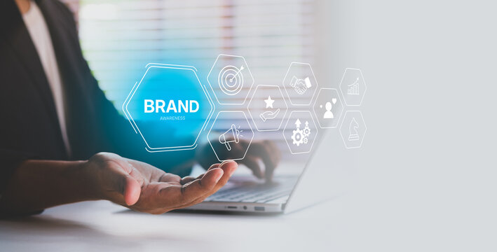 Brand awareness strategy concept, businessman planning digital brand awareness, communication, target, Marketing growth icons, customer loyalty, and partnership symbols for corporate branding success