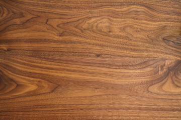 Texture of black walnut table from three boards with oil finish