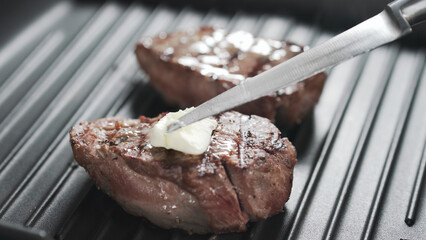 preparing steak filet mignon with butter