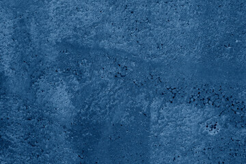 Blue stone background. Toned rock texture. Close-up. Dark blue grunge background
